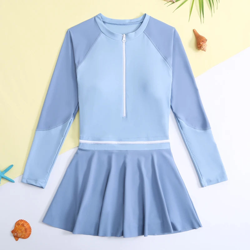 Light blue swimsuit with a skirt on a white background