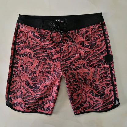 Pink and black patterned shorts on a light gray background