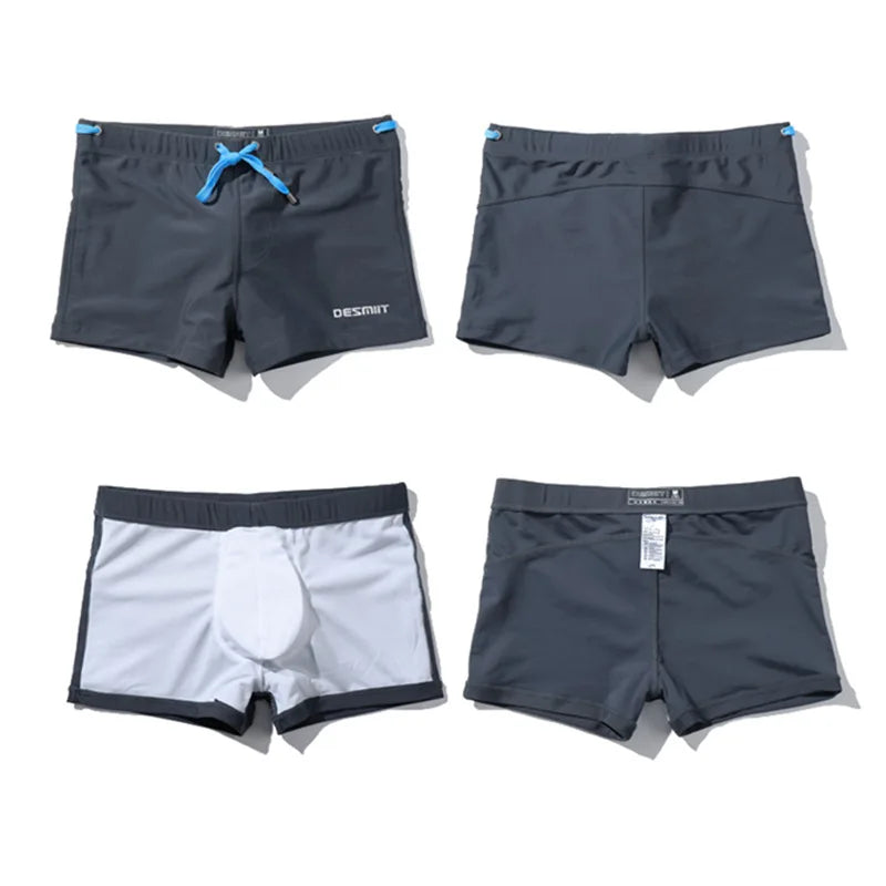 Four pairs of men's shorts in different colors on a white background