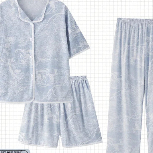 Set of light blue pajamas with a matching shorts on a grid background, featuring the brand 'PAJAMSO'.