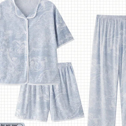 Set of light blue pajamas with a matching shorts on a grid background, featuring the brand 'PAJAMSO'.