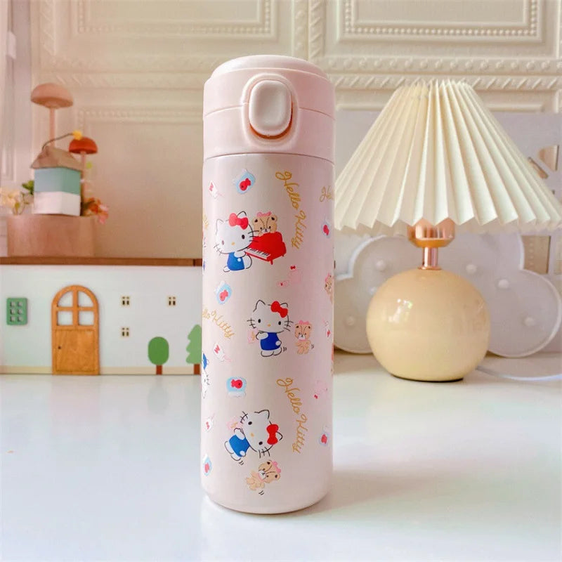 Pink thermos bottle with cartoon designs on a white surface
