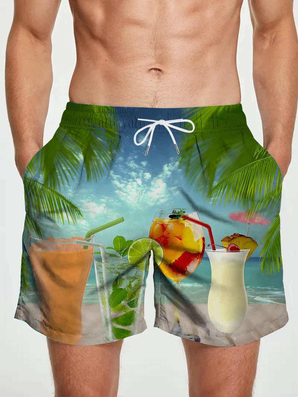Tropical-themed swim shorts with drinks and beach scene on a plain background