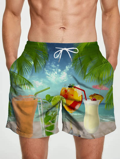 Tropical-themed swim shorts with drinks and beach scene on a plain background