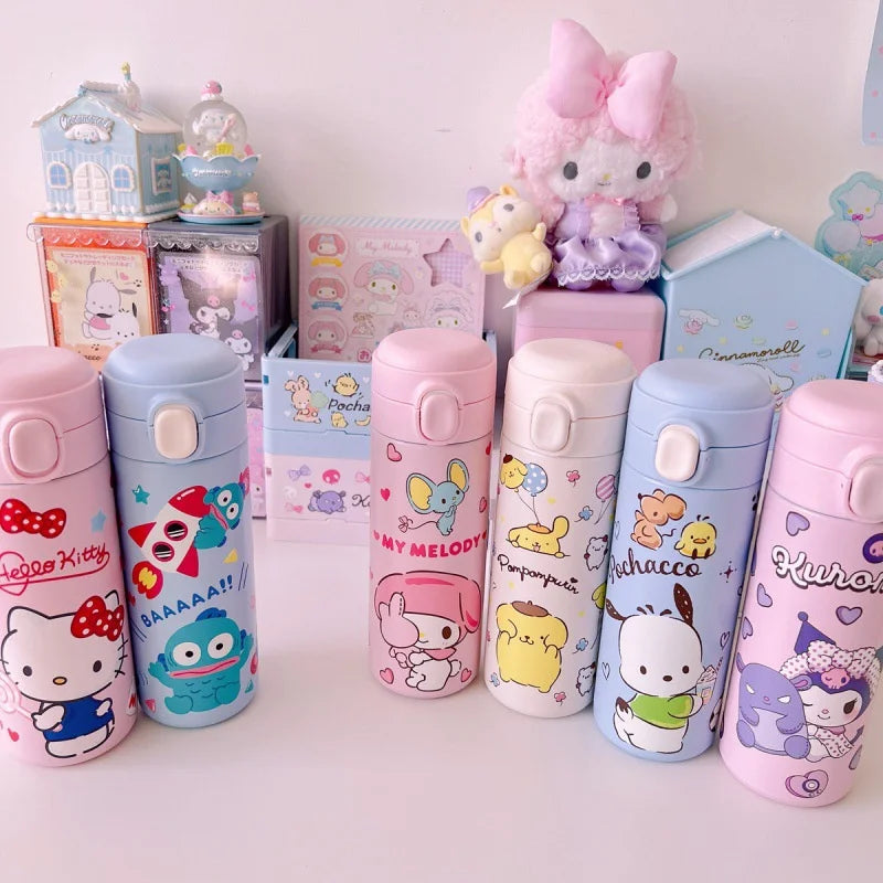 Collection of colorful cartoon-themed water bottles on a white surface with small decorative items in the background.