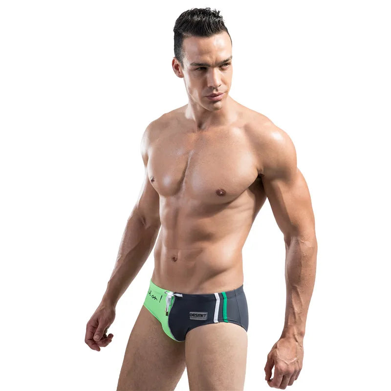 Man wearing a green and black underwear set on a white background
