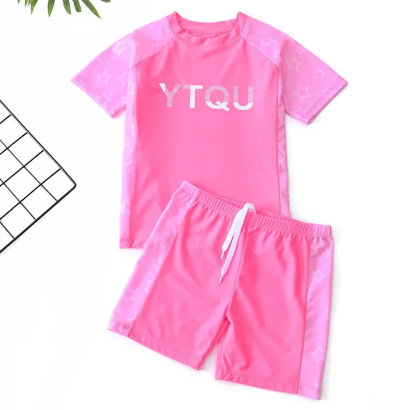Pink swim set with 'YTQU' text on a white background