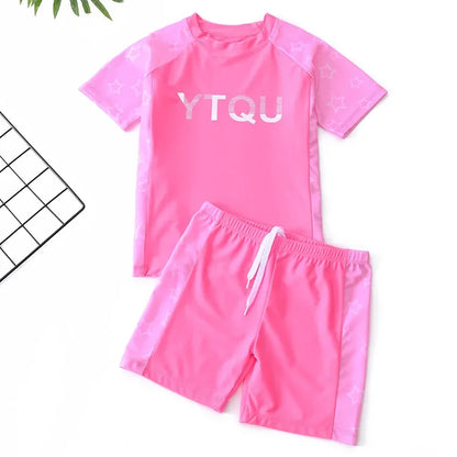 Pink swim set with 'YTQU' text on a white background