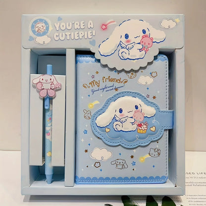 Cute stationery set with a cartoon character in a box, featuring a pen, notebook, and stickers.