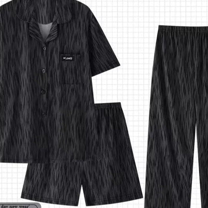 Black pajama set with a shirt, shorts, and pants on a grid background with 'PAJAMSO' branding.