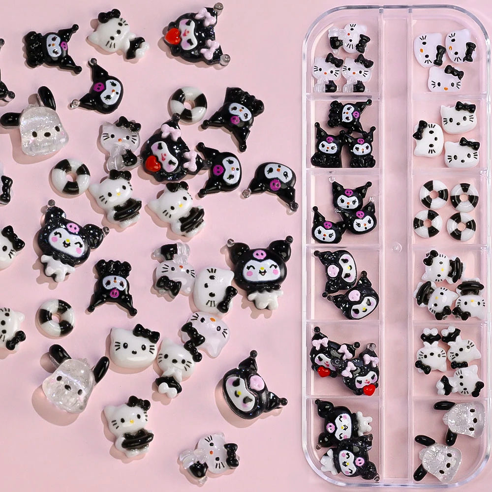 Collection of black and white cat-shaped nail art decorations on a pink background