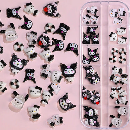 Collection of black and white cat-shaped nail art decorations on a pink background