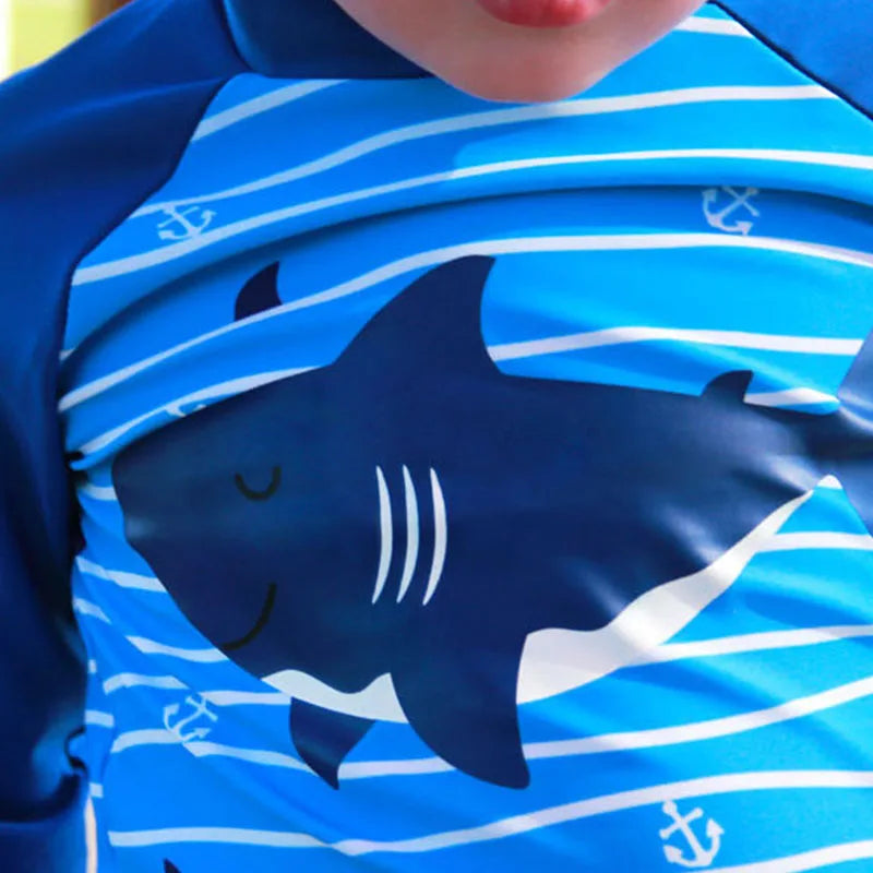 Blue shirt with shark design and anchor patterns