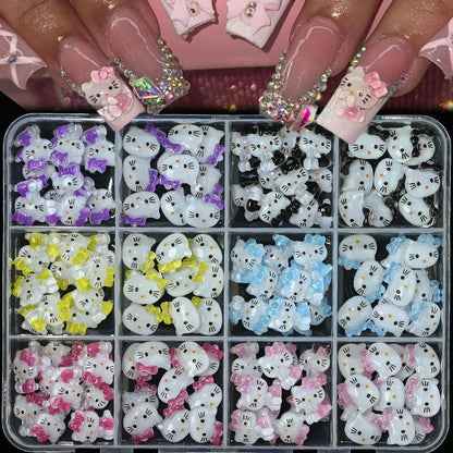 Box of Hello Kitty-themed nail art decorations with various colors.
