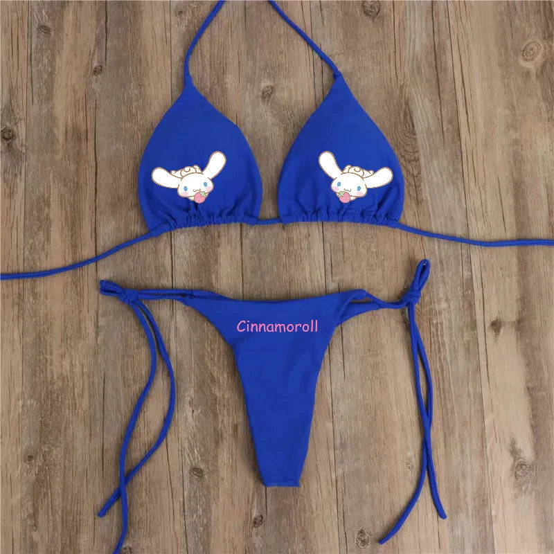 Blue bikini set with cartoon character design on a wooden surface