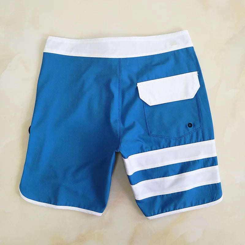 Blue and white striped shorts on a beige background