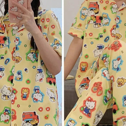 Yellow children's outfit with cartoon character patterns worn by a person.