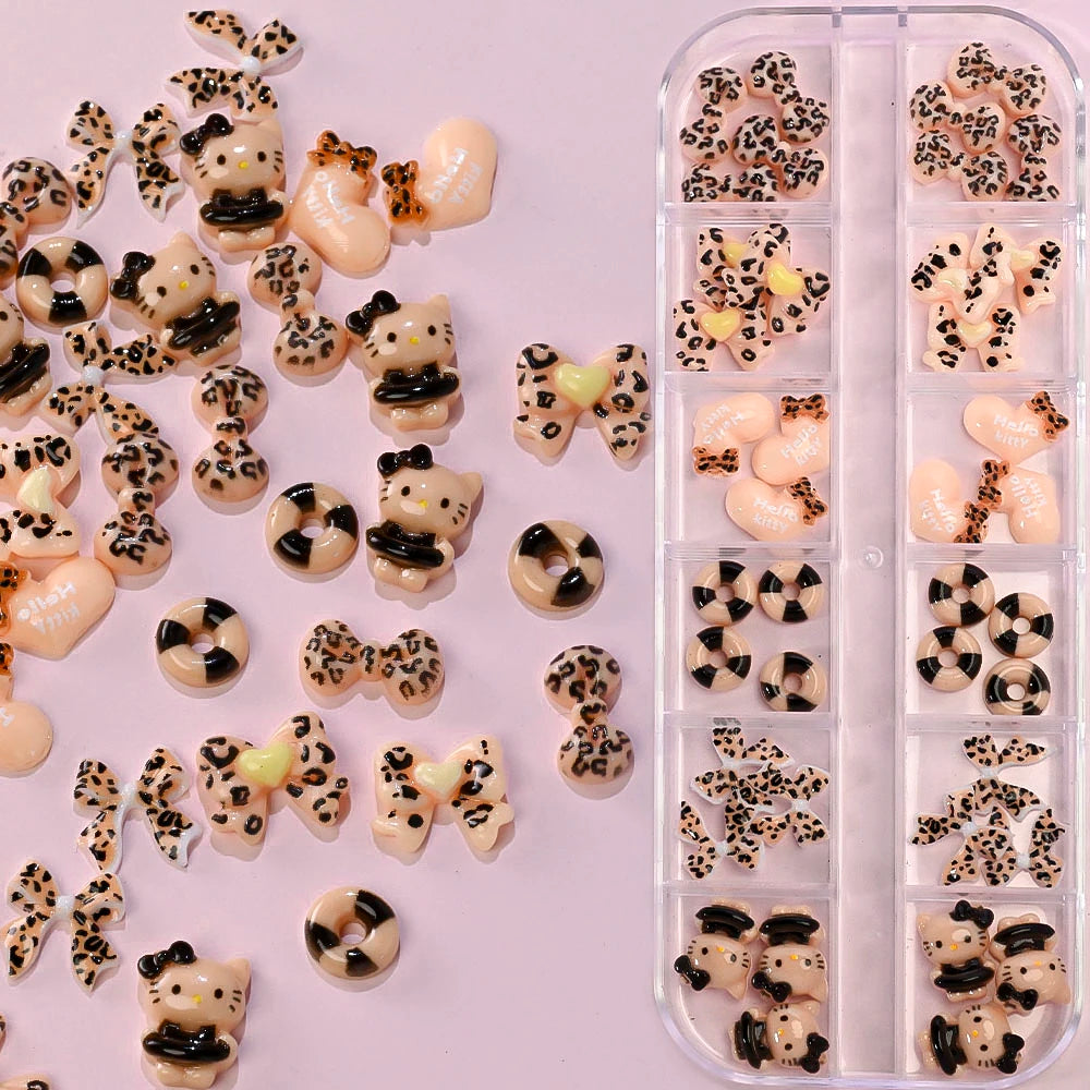 Leopard print nail art decorations on a pink background with a clear organizer.