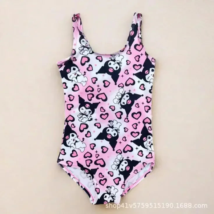 Pink swimsuit with black and white patterns on a beige background