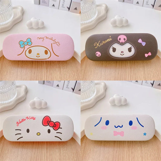 Four colorful eyeglass cases with cartoon character designs on a wooden surface.