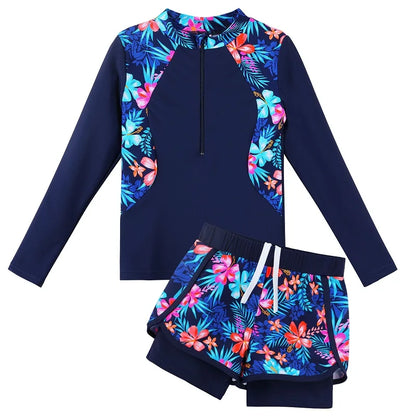 Navy blue swimsuit with colorful floral patterns on a white background