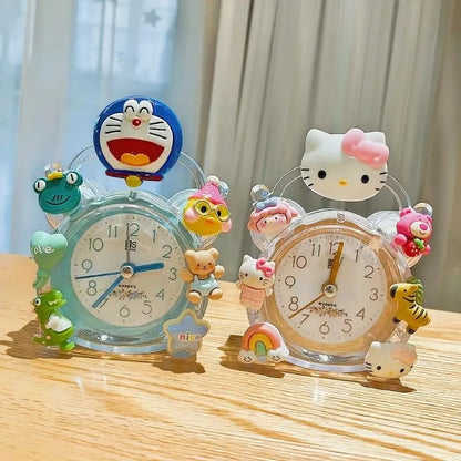 Two cartoon-themed alarm clocks on a wooden surface with a light background
