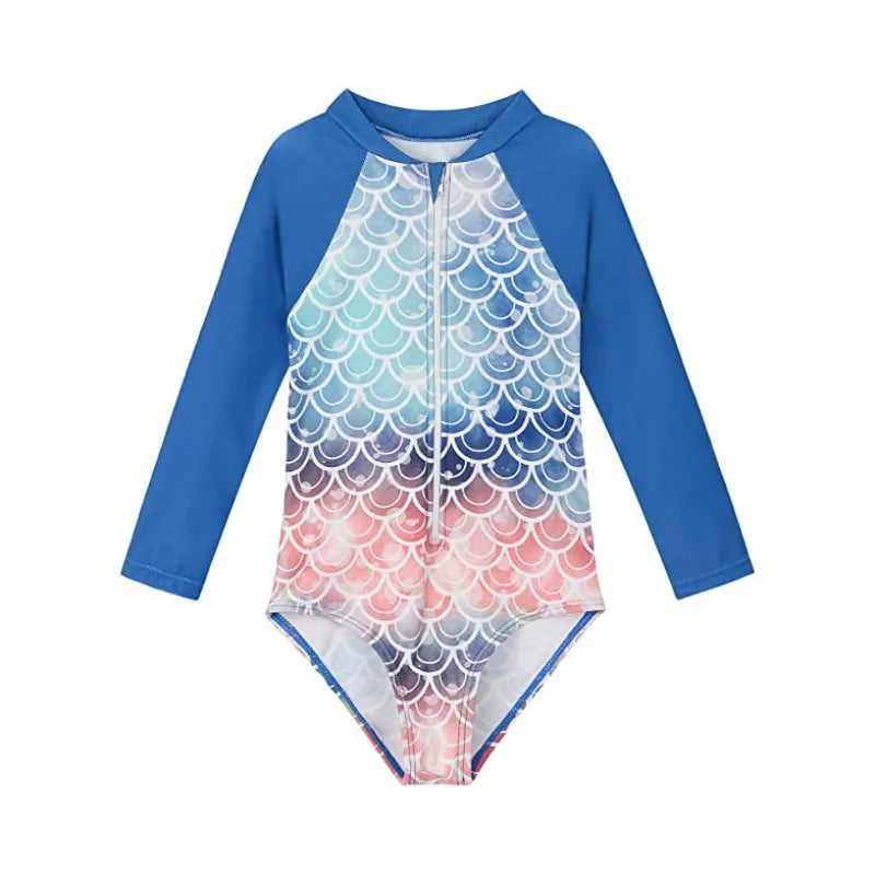 Children's swimsuit with blue sleeves and colorful scale pattern on a white background