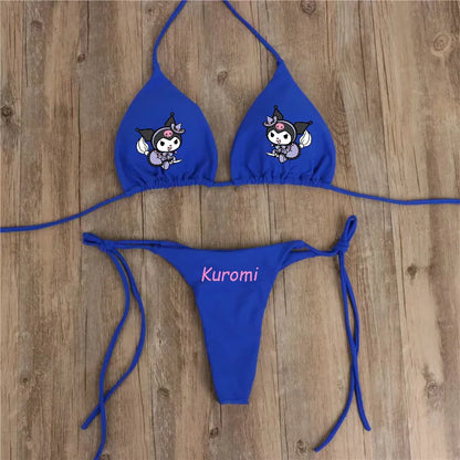 Blue bikini set with cartoon character and 'Kuromi' text on a wooden surface