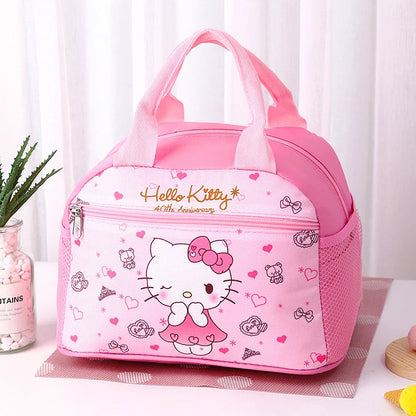 Pink Hello Kitty lunch bag on a white surface with a plant in the background