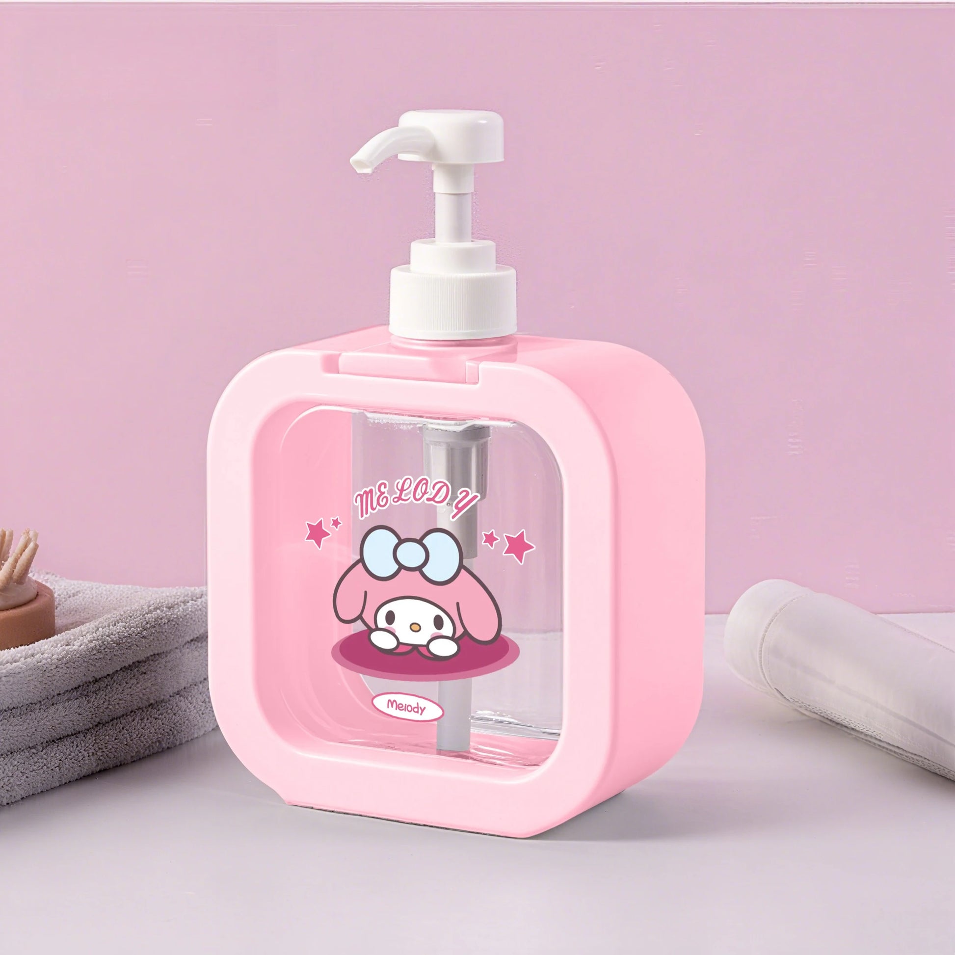Pink soap dispenser with cartoon character on a pink background