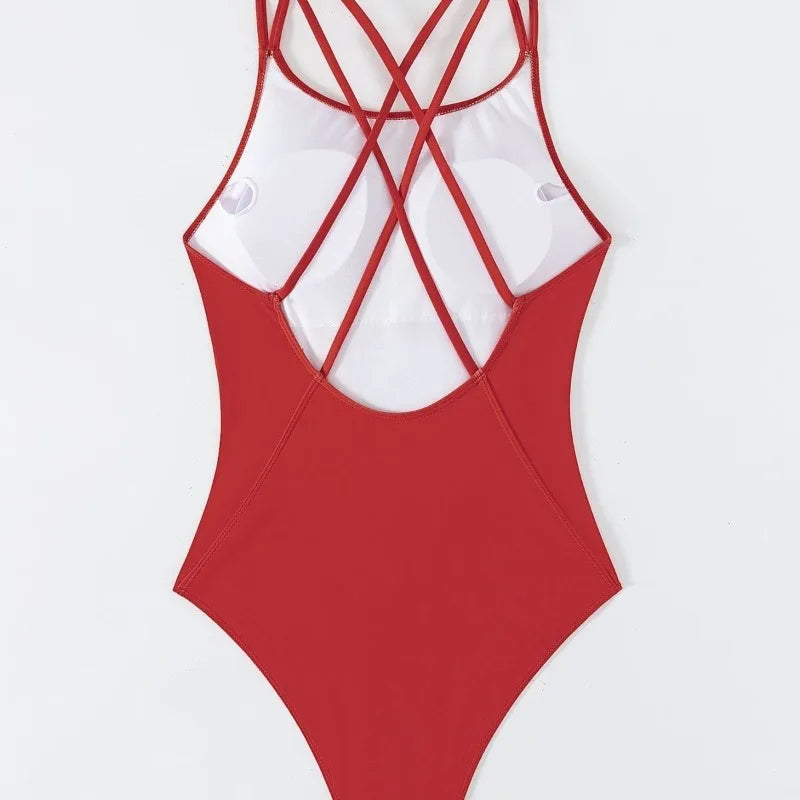 Red swimsuit with white top on a light gray background