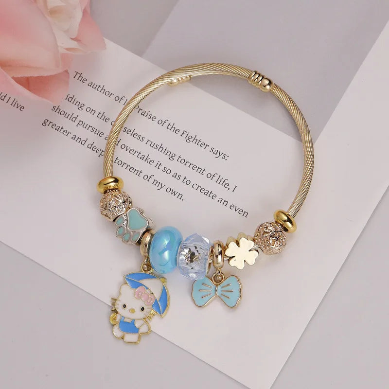 Bracelet with Hello Kitty charm on a book page