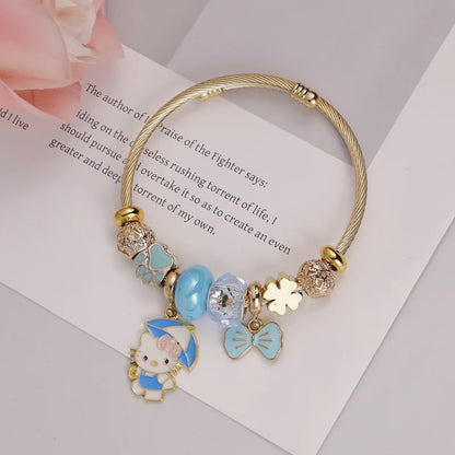 Bracelet with Hello Kitty charm on a book page