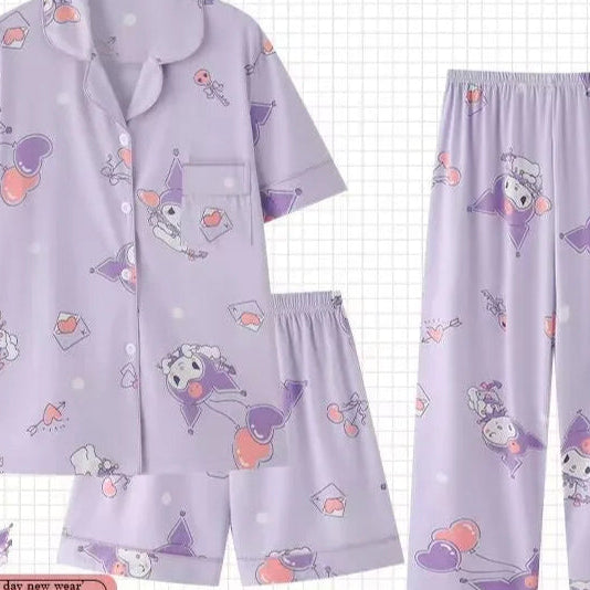 Purple pajama set with cartoon characters on a checkered background, featuring the brand 'PAJAMS'.