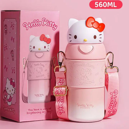 Hello Kitty water bottle with strap and packaging on a pink background