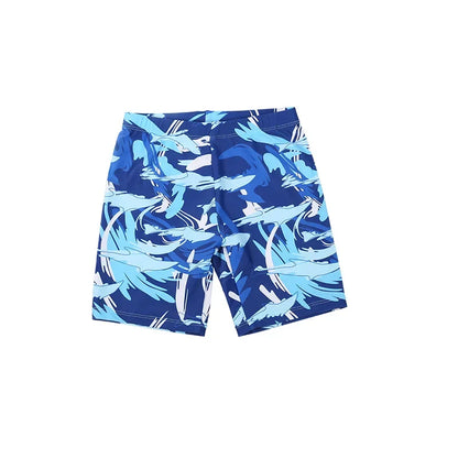 Blue swim shorts with shark pattern on a white background