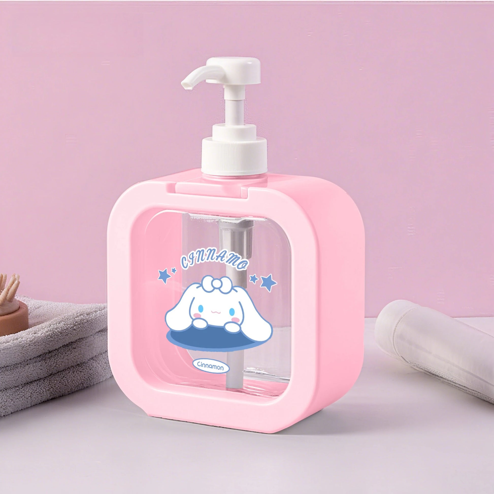 Pink soap dispenser with cartoon character on a pink background