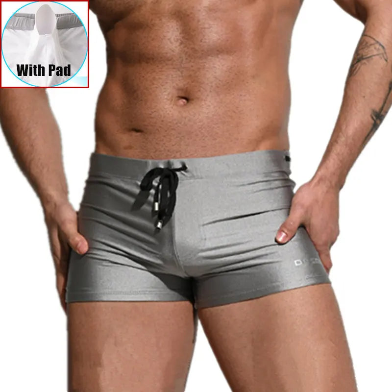 Gray boxer briefs worn by a person with an inset showing a white pad.