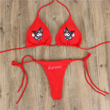 Red bikini set with cartoon character design on a wooden surface