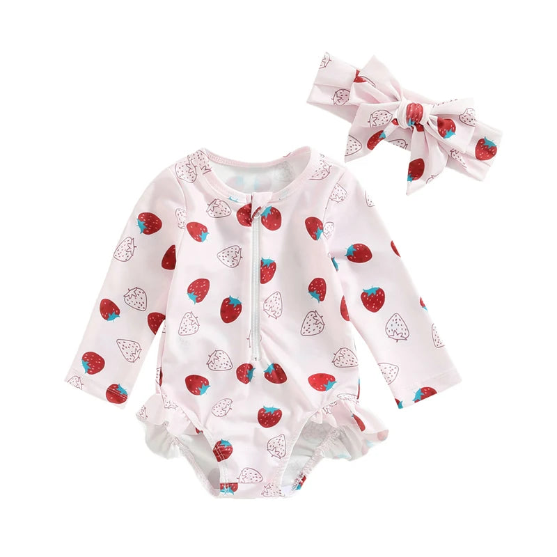 Baby romper with strawberry pattern and matching headband on a white background