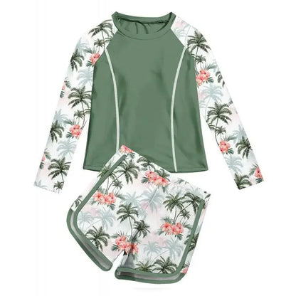 Two-piece swimsuit with palm tree and floral pattern on a white background