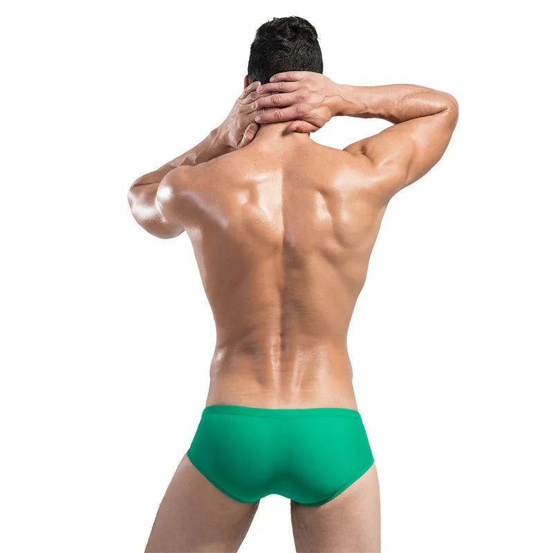 Man wearing green underwear on a white background