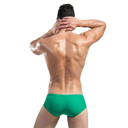 Man wearing green underwear on a white background