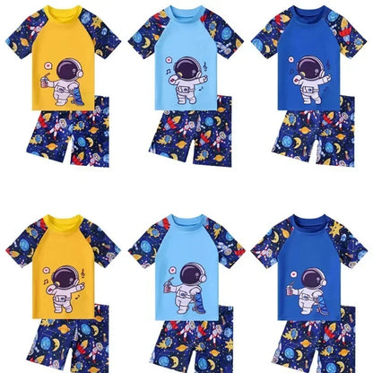 Set of children's swimwear with astronaut design on a white background