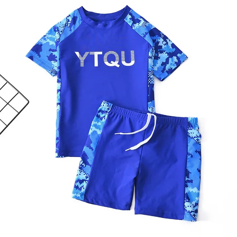 Blue swim set with camouflage sleeves and shorts on a white background