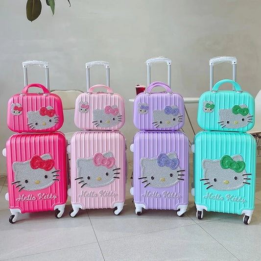 Set of colorful Hello Kitty suitcases on a light background