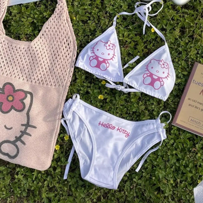 Hello Kitty bikini set and bag on grass