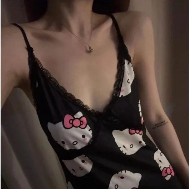 Black slip dress with Hello Kitty print worn by a person.