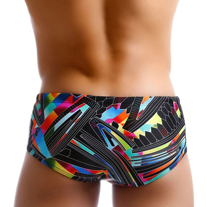 Colorful swim briefs with geometric pattern on a white background