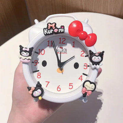 Kawaii-style clock with cartoon characters and a red bow held by a hand.